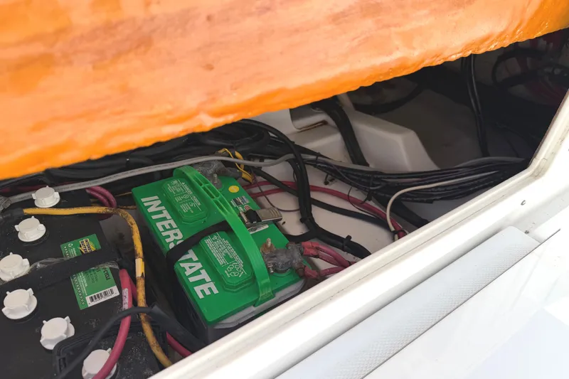 Slide: The Image of Battery compartment of 2008 Southport 28 Tournament Express with Interstate batteries and wiring. - 17