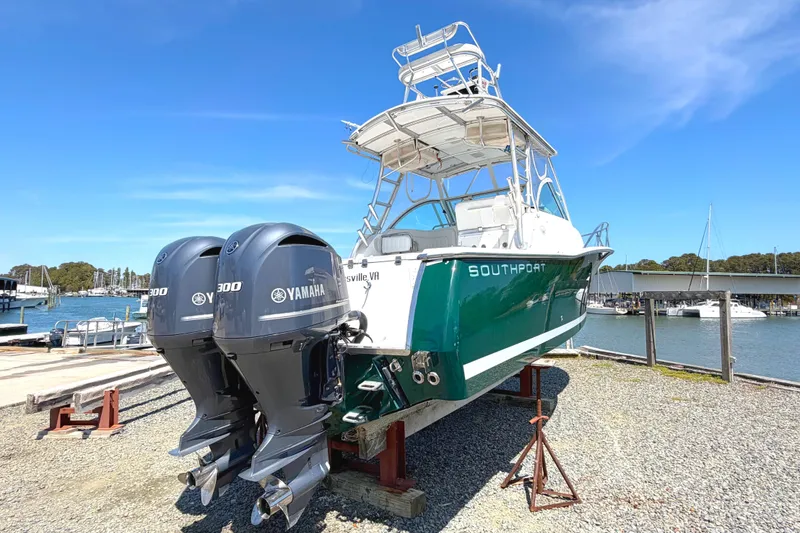 Slide: The Image of 2008 Southport 28 Tournament Express boat with twin Yamaha 300 engines on display. - 2