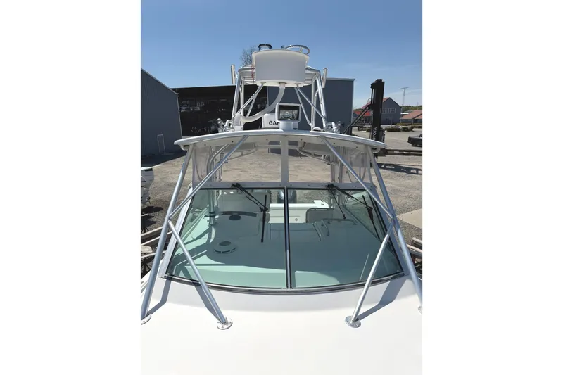 Slide: The Image of 2008 Southport 28 Tournament Express boat with tower and windshield, docked outdoors. - 25