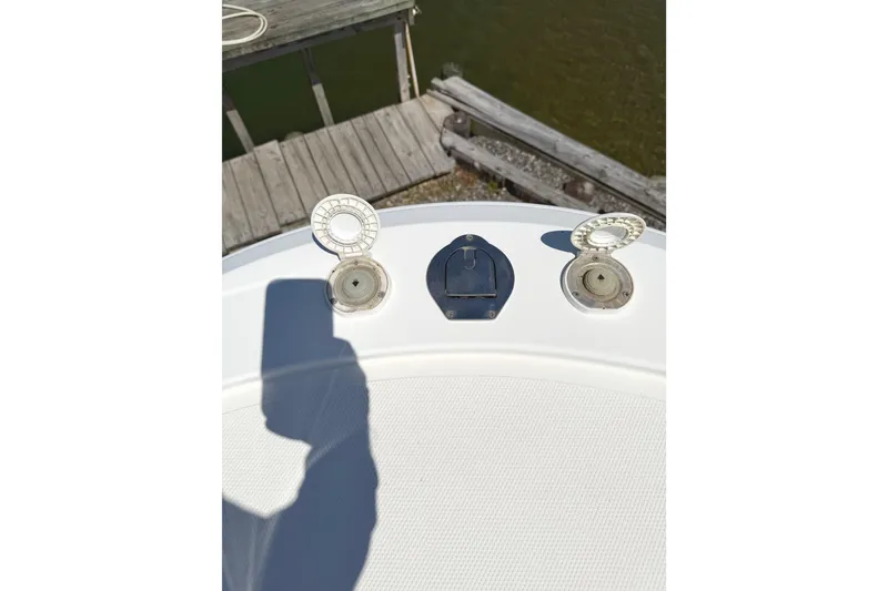 Slide: The Image of 2008 Southport 28 Tournament Express boat deck with open hatches near dock. - 27