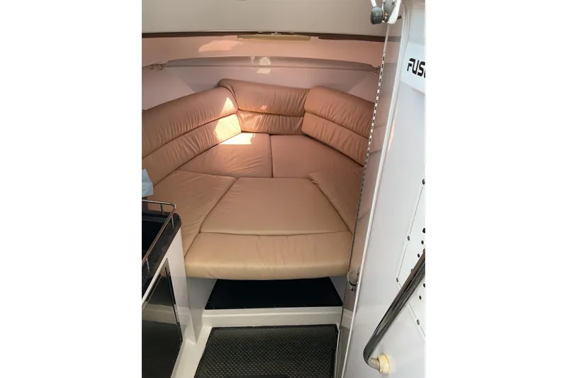 Slide: The Image of Interior cabin of 2008 Southport 28 Tournament Express with beige seating. - 29