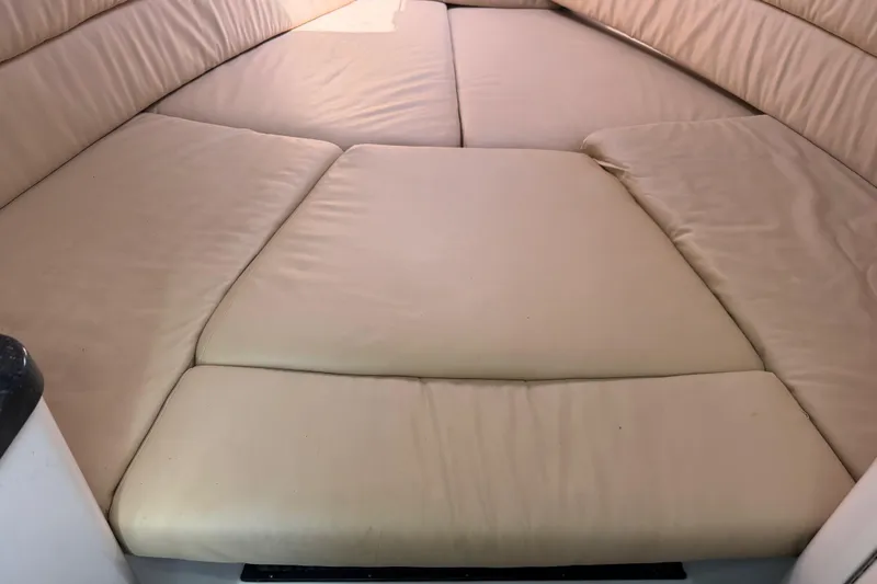 Slide: The Image of Interior cabin view of 2008 Southport 28 Tournament Express with beige cushions. - 31