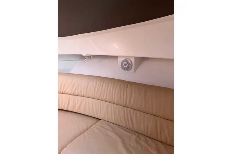Slide: The Image of Interior of 2008 Southport 28 Tournament Express with beige seating and wall speaker. - 33