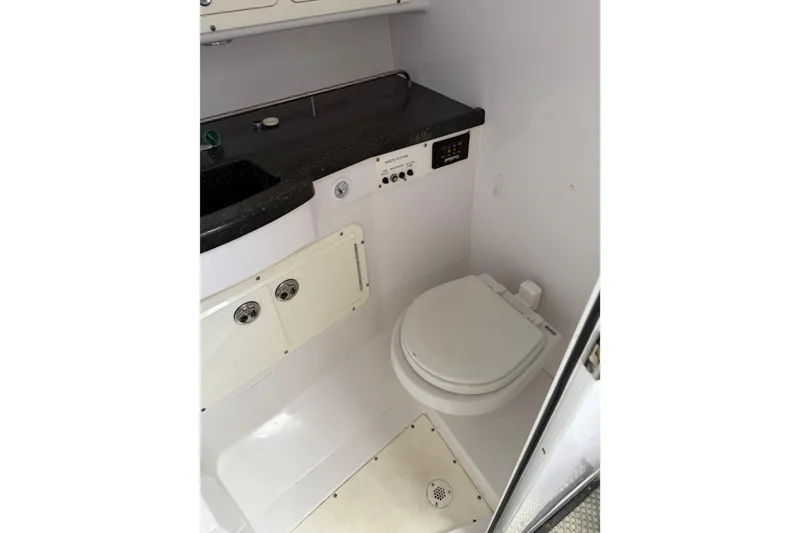 Slide: The Image of 2008 Southport 28 Tournament Express boat bathroom with toilet and sink. - 35