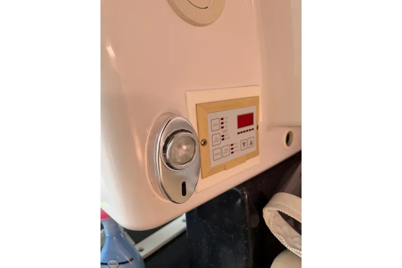 Slide: The Image of Control panel and light fixture on 2008 Southport 28 Tournament Express boat. - 46