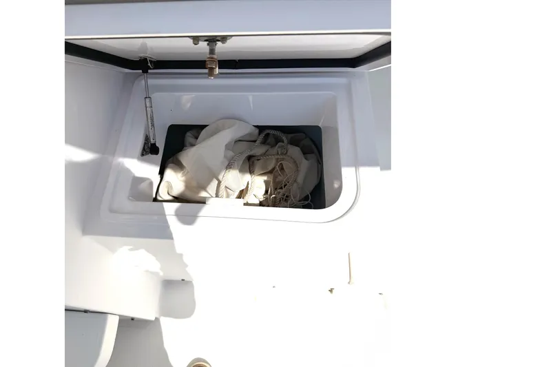 Slide: The Image of Storage compartment on a 2008 Southport 28 Tournament Express boat with ropes inside. - 7