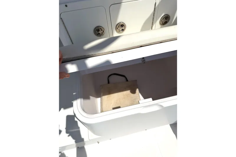 Slide: The Image of Open storage compartment on 2008 Southport 28 Tournament Express boat. - 8