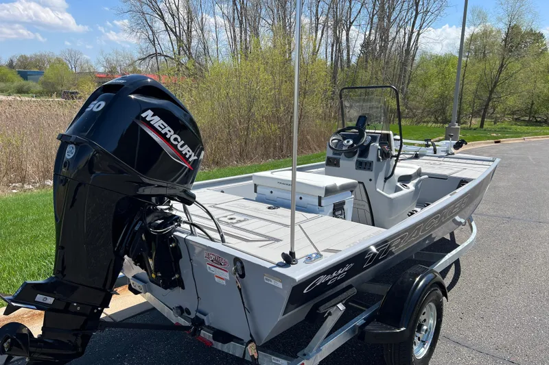 Slide: The Image of 2026 Tracker Bass Tracker Classic CC boat with Mercury engine on trailer. - 2