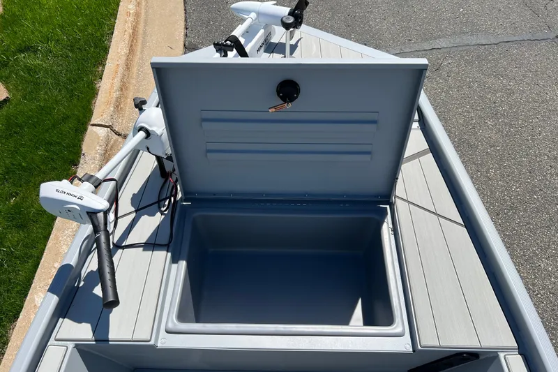 Slide: The Image of Open storage compartment on 2026 Tracker Bass Tracker Classic CC boat deck. - 6