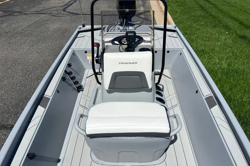 Slide: The Image of 2026 Tracker Bass Tracker Classic CC boat interior with steering console and seating. - 7