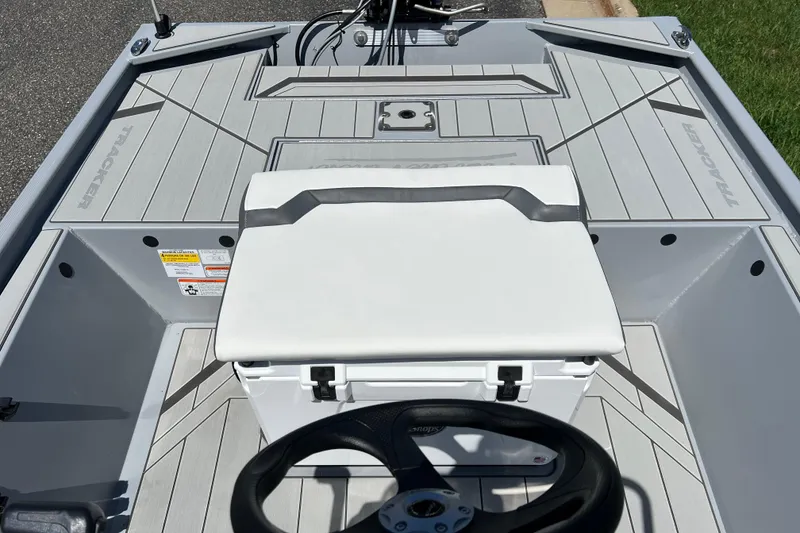 Slide: The Image of 2026 Tracker Bass Tracker Classic CC boat interior with steering wheel and cushioned seat. - 8