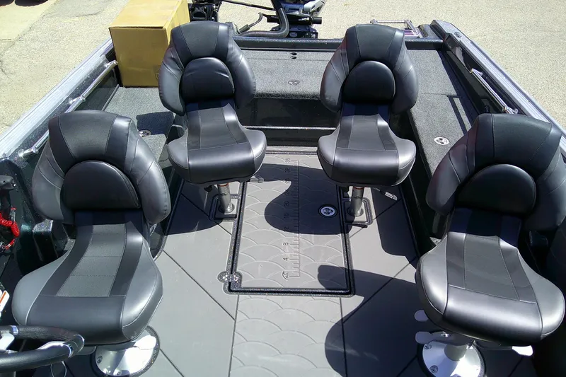 Slide: The Image of Four black seats on a 2026 Nitro ZV20 boat deck. - 6