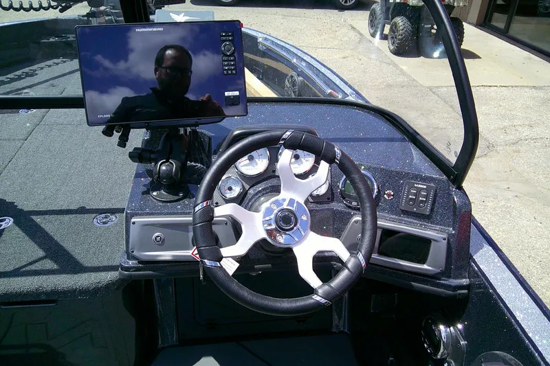 Slide: The Image of 2026 Nitro ZV20 boat dashboard with steering wheel and electronic display. - 8