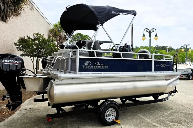 The Image of 2026 Sun Tracker Bass Buggy 16 XL Select pontoon boat with Mercury engine on trailer. - 0