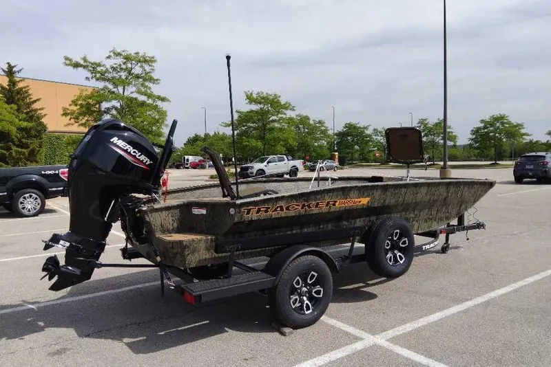 The Image of 2026 Tracker Grizzly 1756 T Marsh boat on trailer in parking lot. - 0