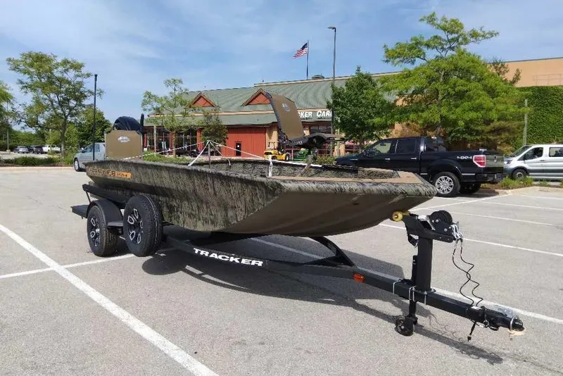 Slide: The Image of 2026 Tracker Grizzly 1756 T Marsh boat on trailer in parking lot. - 3