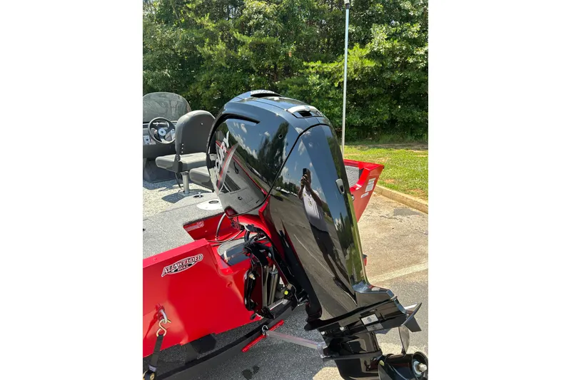 Slide: The Image of 2026 Tracker Pro Guide V-16 SC boat with a powerful outboard motor. - 3