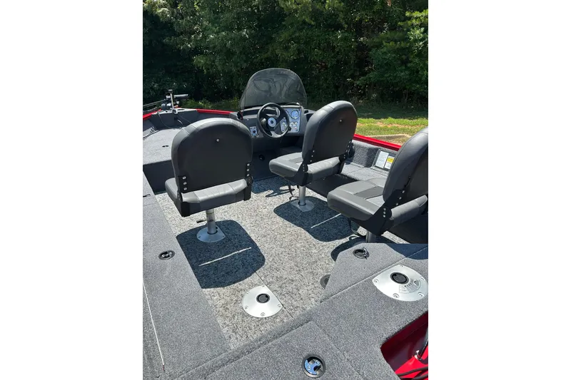Slide: The Image of 2026 Tracker Pro Guide V-16 SC boat interior with seating and steering console. - 4