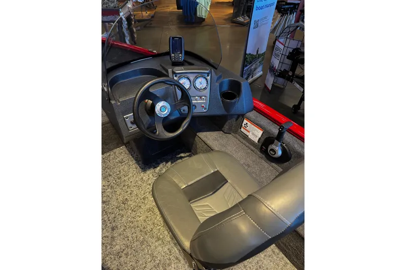 Slide: The Image of Interior view of 2026 Tracker Pro Guide V-16 SC boat with steering wheel and dashboard. - 6