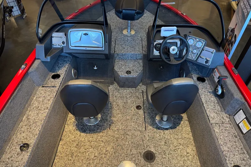 Slide: The Image of Interior of 2026 Tracker Pro Guide V-175 WT boat with dual seats and control panel. - 6