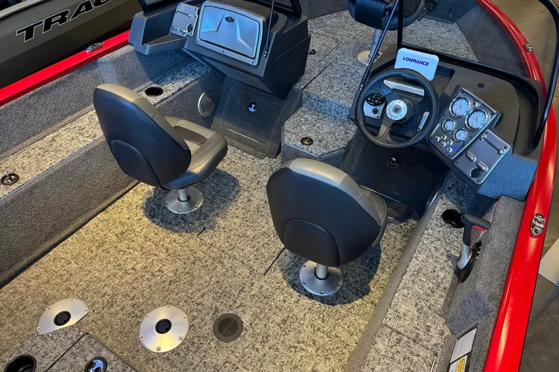 Slide: The Image of 2026 Tracker Pro Guide V-175 WT boat interior with steering console and seating. - 7