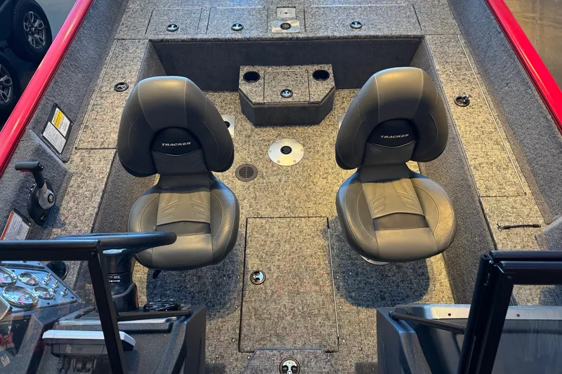 Slide: The Image of 2026 Tracker Pro Guide V-175 WT boat interior with two seats and carpeted flooring. - 8