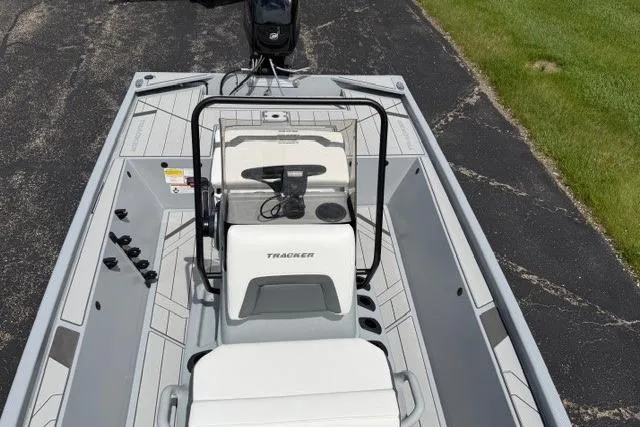 Slide: The Image of 2026 Tracker Bass Tracker Classic CC boat interior with steering console and seating. - 6