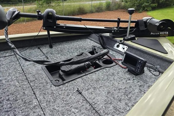 Slide: The Image of 2026 Tracker Pro Team 190 boat deck with trolling motor and fish finder. - 5