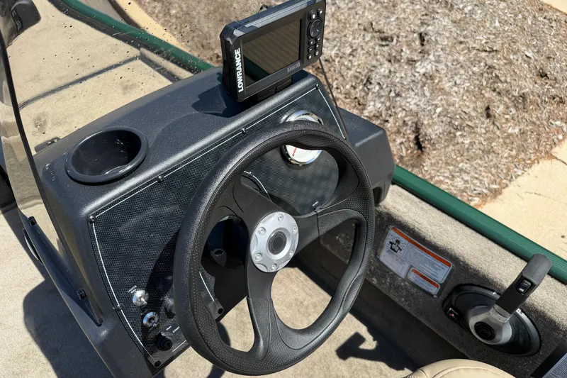 Slide: The Image of Steering console of 2026 Tracker Bass Tracker Classic Limited boat with navigation system. - 2