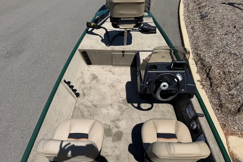 Slide: The Image of 2026 Tracker Bass Tracker Classic Limited boat interior with steering wheel and seating. - 3