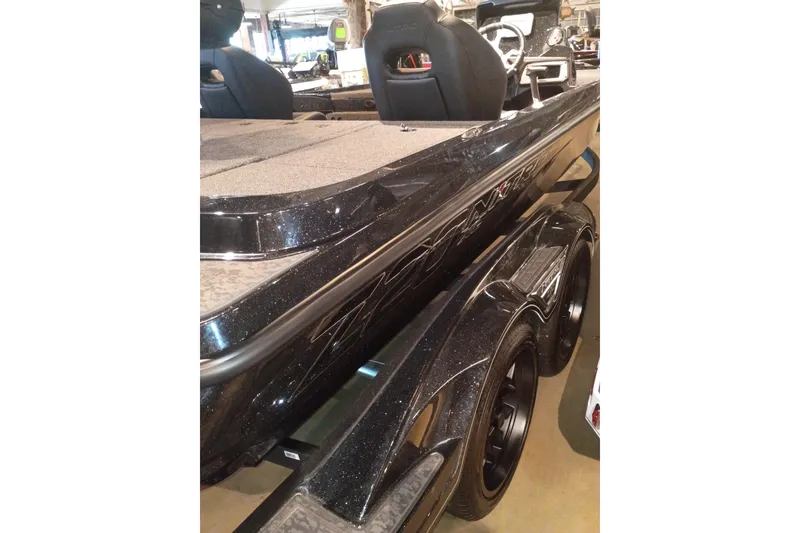 Slide: The Image of 2026 Nitro Z20 XL boat, sleek black design, dual wheels, showroom display. - 10