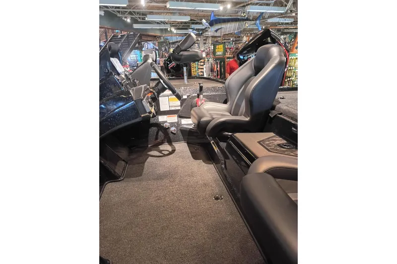 Slide: The Image of Interior of 2026 Nitro Z20 XL boat showcasing seating and steering area. - 11