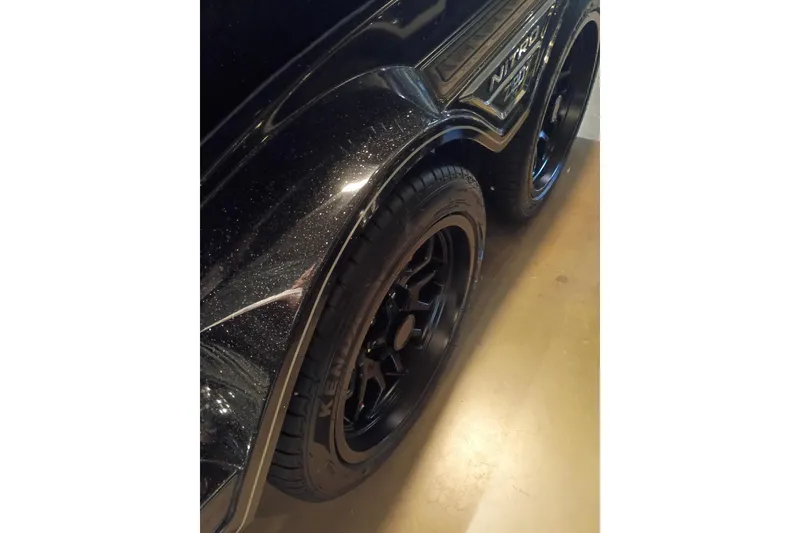 Slide: The Image of 2026 Nitro Z20 XL with sleek black wheels and metallic finish. - 8