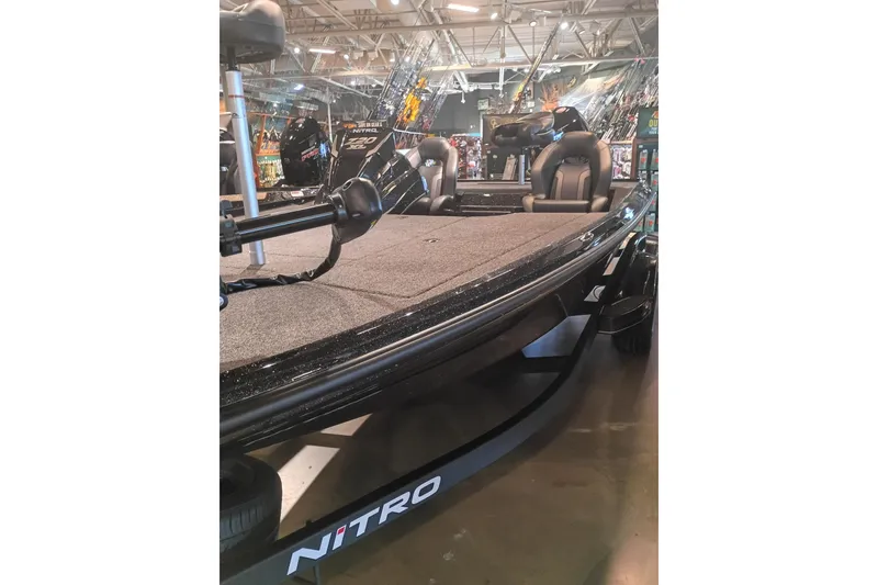 Slide: The Image of 2026 Nitro Z20 XL fishing boat displayed indoors, featuring sleek design and comfortable seating. - 1