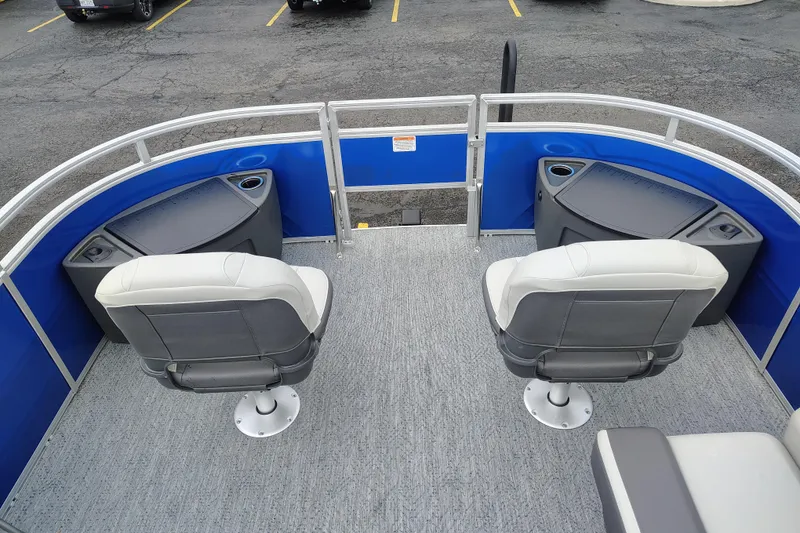 Slide: The Image of 2026 Sun Tracker Fishin' Barge 20 DLX with dual swivel seats and blue railing. - 104