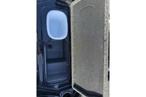 Slide: The Image of 2026 Nitro Z20 XL boat storage compartment with open lid, showcasing interior space. - 12
