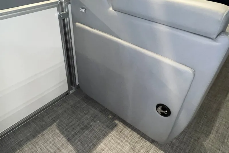 Slide: The Image of 2026 Sun Tracker Party Barge 20 DLX interior with gray cushioned seating and sleek design. - 31