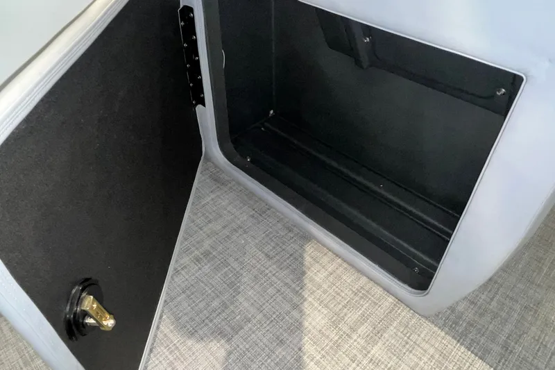 Slide: The Image of Open storage compartment in 2026 Sun Tracker Party Barge 20 DLX pontoon boat. - 34