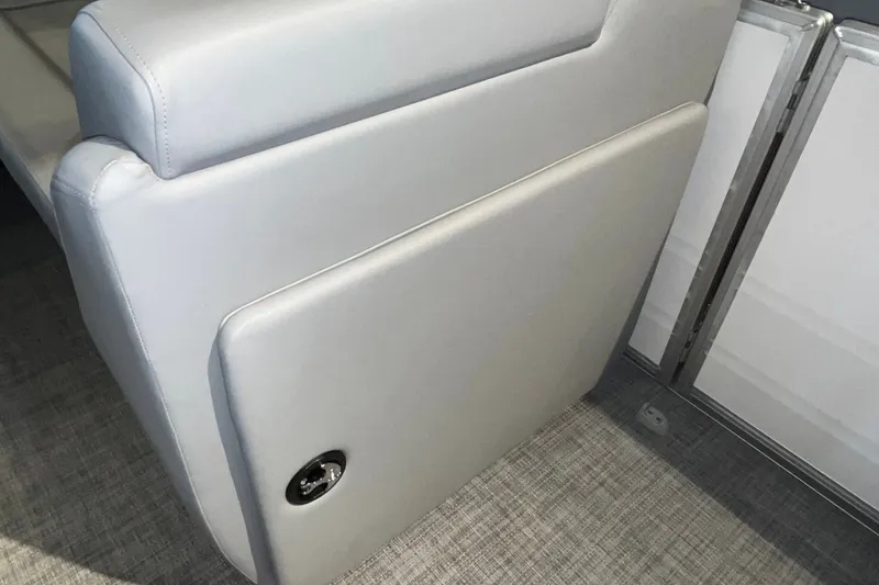 Slide: The Image of 2026 Sun Tracker Party Barge 20 DLX interior seating detail with gray upholstery. - 32