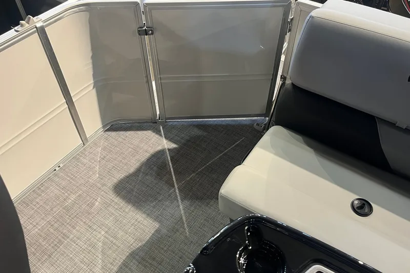 Slide: The Image of Interior of 2026 Sun Tracker Party Barge 20 DLX with seating and flooring details. - 13