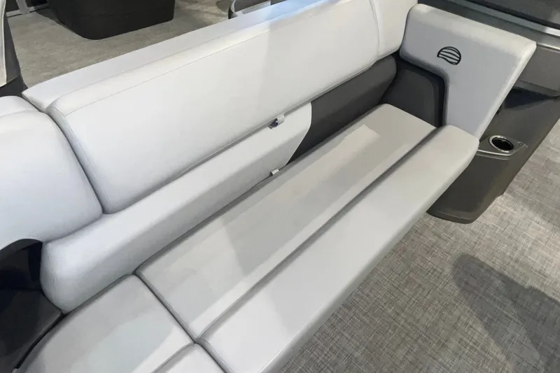 Slide: The Image of 2026 Sun Tracker Party Barge 20 DLX interior seating, featuring sleek gray upholstery. - 27