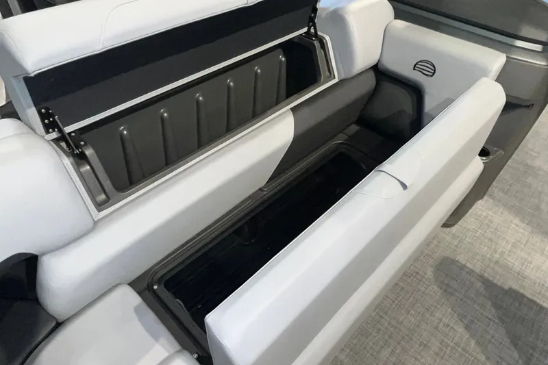 Slide: The Image of 2026 Sun Tracker Party Barge 20 DLX storage compartment with open seating. - 19