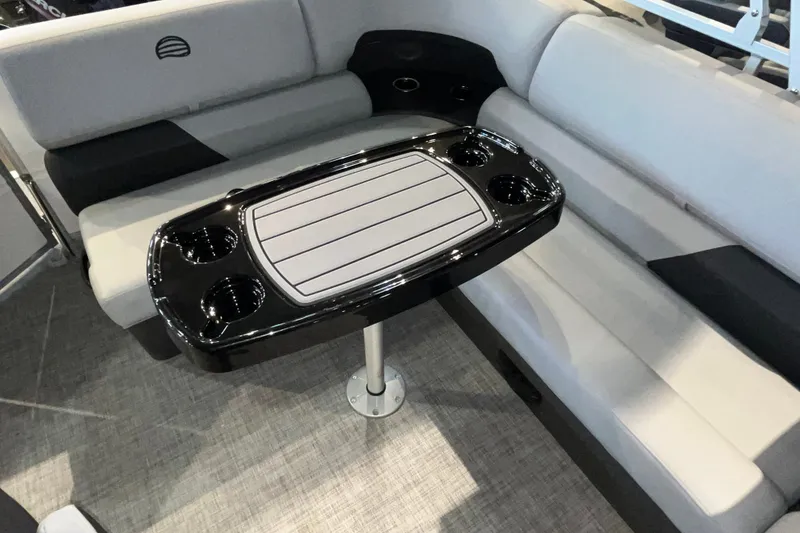 Slide: The Image of Interior of 2026 Sun Tracker Party Barge 20 DLX with seating and table. - 14