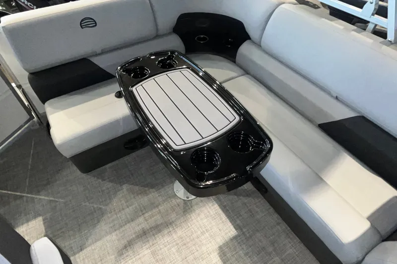 Slide: The Image of Interior of 2026 Sun Tracker Party Barge 20 DLX with seating and table. - 16