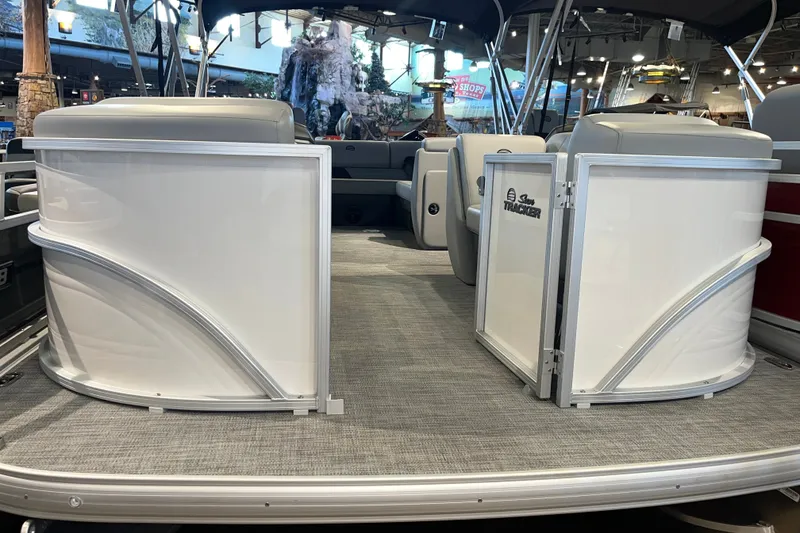 The Image of 2026 Sun Tracker Party Barge 20 DLX interior with seating and open deck view. - 0