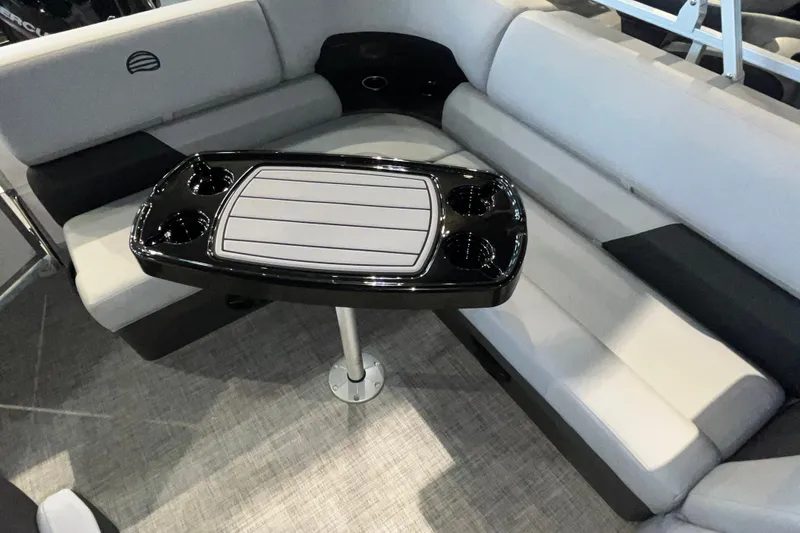 Slide: The Image of Interior of 2026 Sun Tracker Party Barge 20 DLX with seating and table. - 15