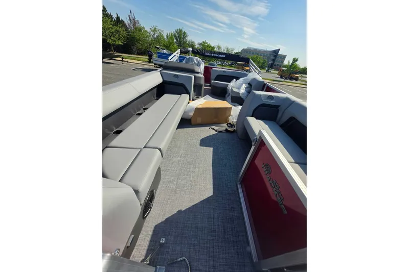 Slide: The Image of 2026 Sun Tracker Party Barge 18 DLX interior with spacious seating and modern design. - 13