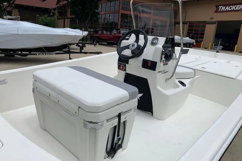 Slide: The Image of 2026 Mako Pro Skiff 17 CC boat interior with console and seating. - 6