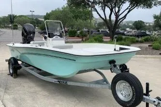 The Image of 2026 Mako Pro Skiff 17 CC boat on trailer, parked outdoors. - 0