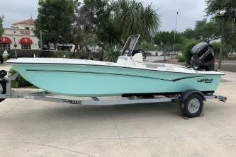 Slide: The Image of 2026 Mako Pro Skiff 17 CC boat on trailer, parked outdoors. - 5